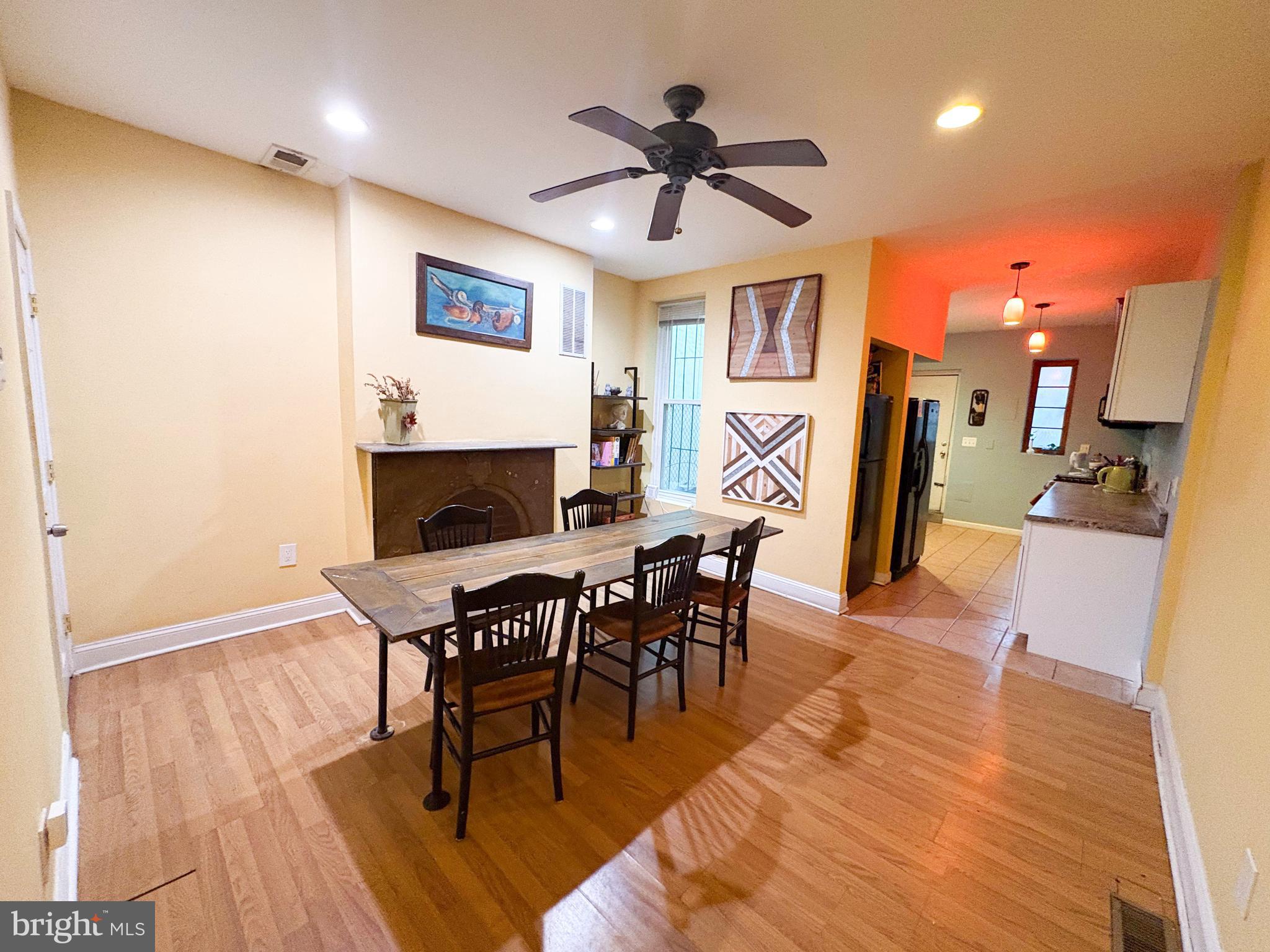754 Dolphin Street Baltimore, MD 21217 - Photo 4 of 23 a view of a a dining room with furniture window and wooden floor
