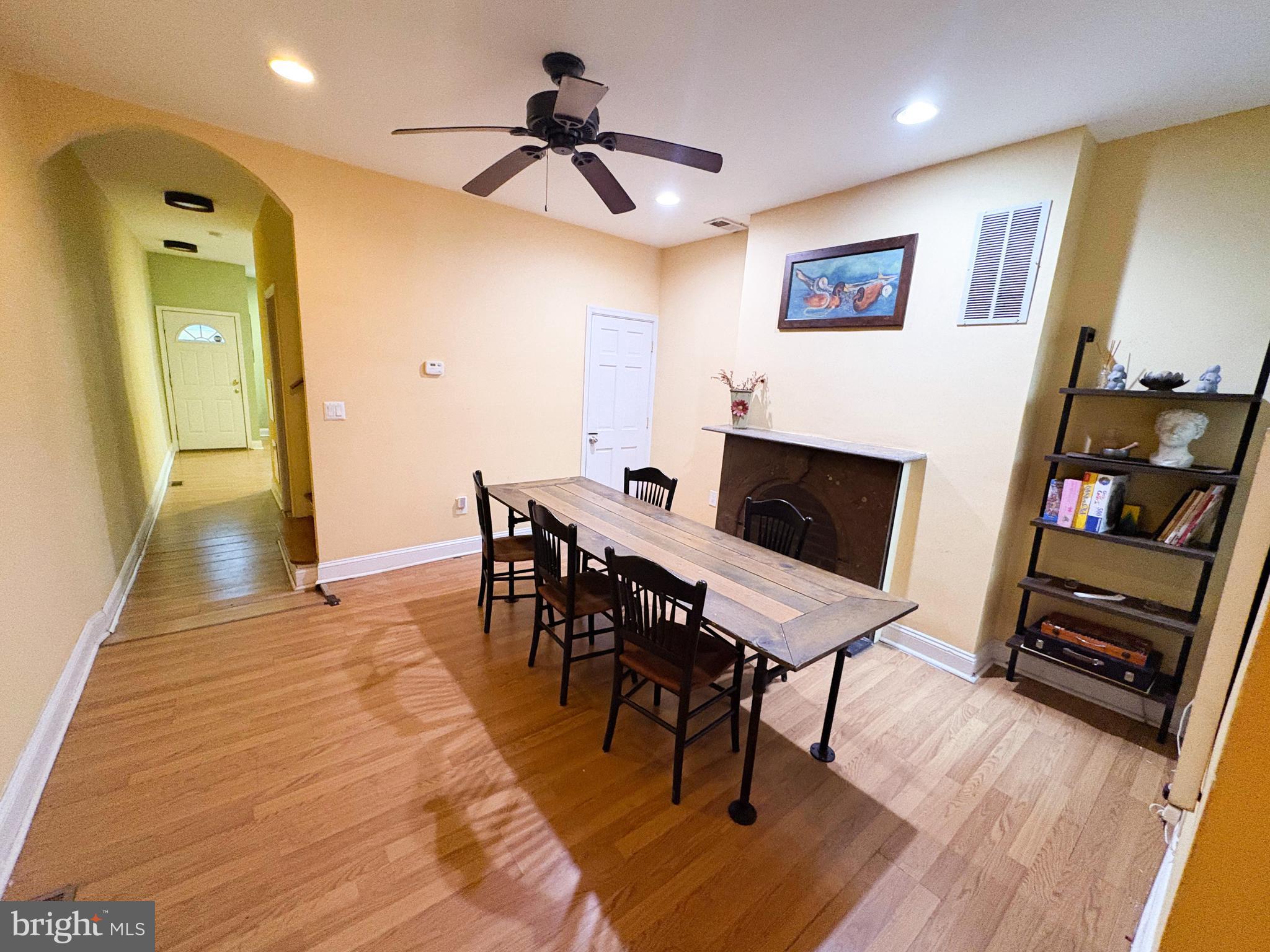 754 Dolphin Street Baltimore, MD 21217 - Photo 5 of 23 a view of a dining room with furniture and wooden floor