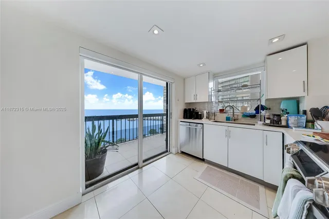 a view of balcony with furniture and city view