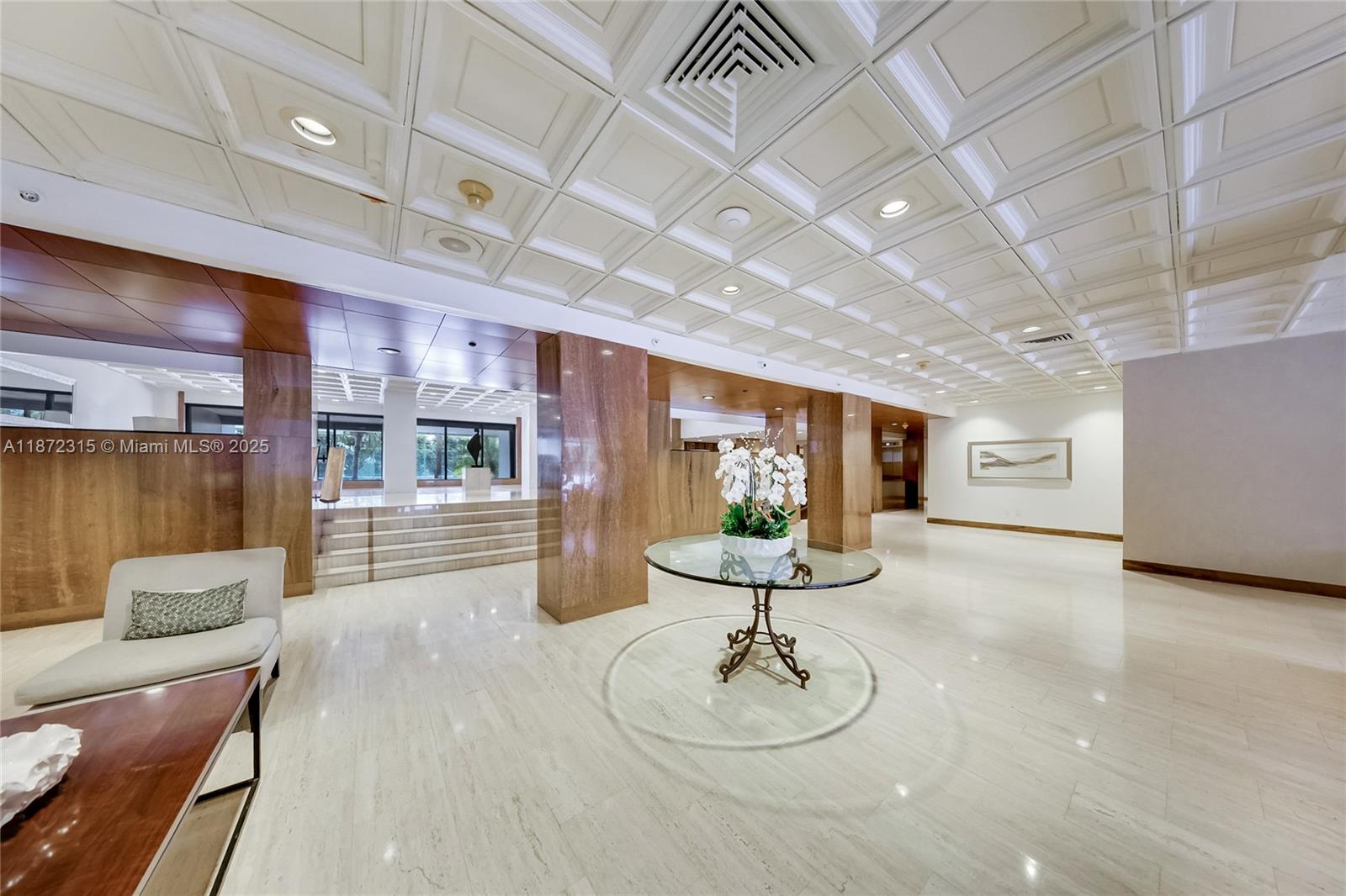 2333 Brickell Avenue, Unit 1406 Miami, FL 33129 - Photo 7 of 31 a room with stainless steel appliances kitchen island granite countertop furniture and a kitchen view