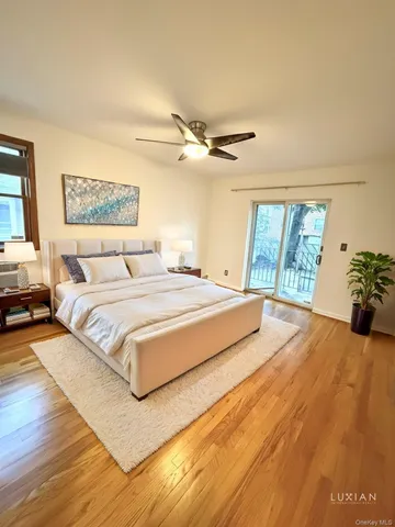 a bedroom with a large bed and a window