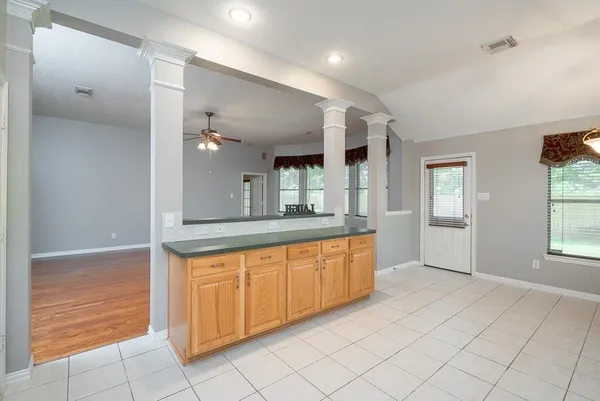 a large bathroom with a large tub and sink