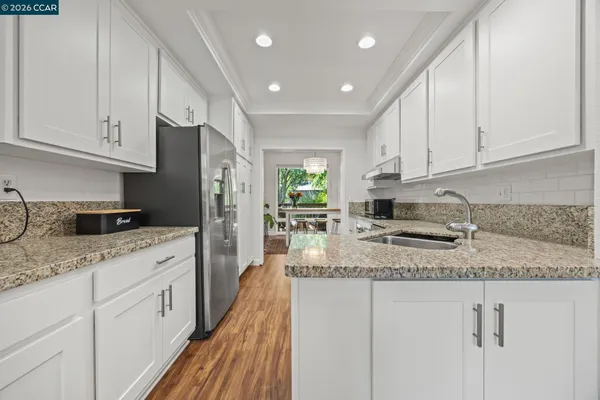 a view of balcony with wooden floor and outdoor seating