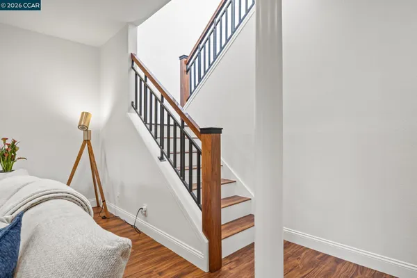 a bed room with a bed and a chair