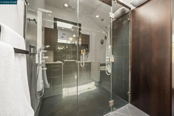 a bathroom with a bathtub and a shower
