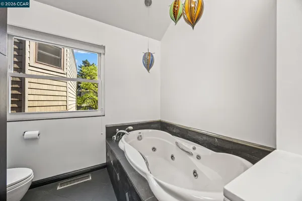 a bedroom with a bed and a book shelf