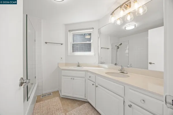a view of a terrace with chairs and potted plants