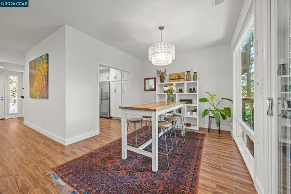 a view of a dining room with furniture window and outside view