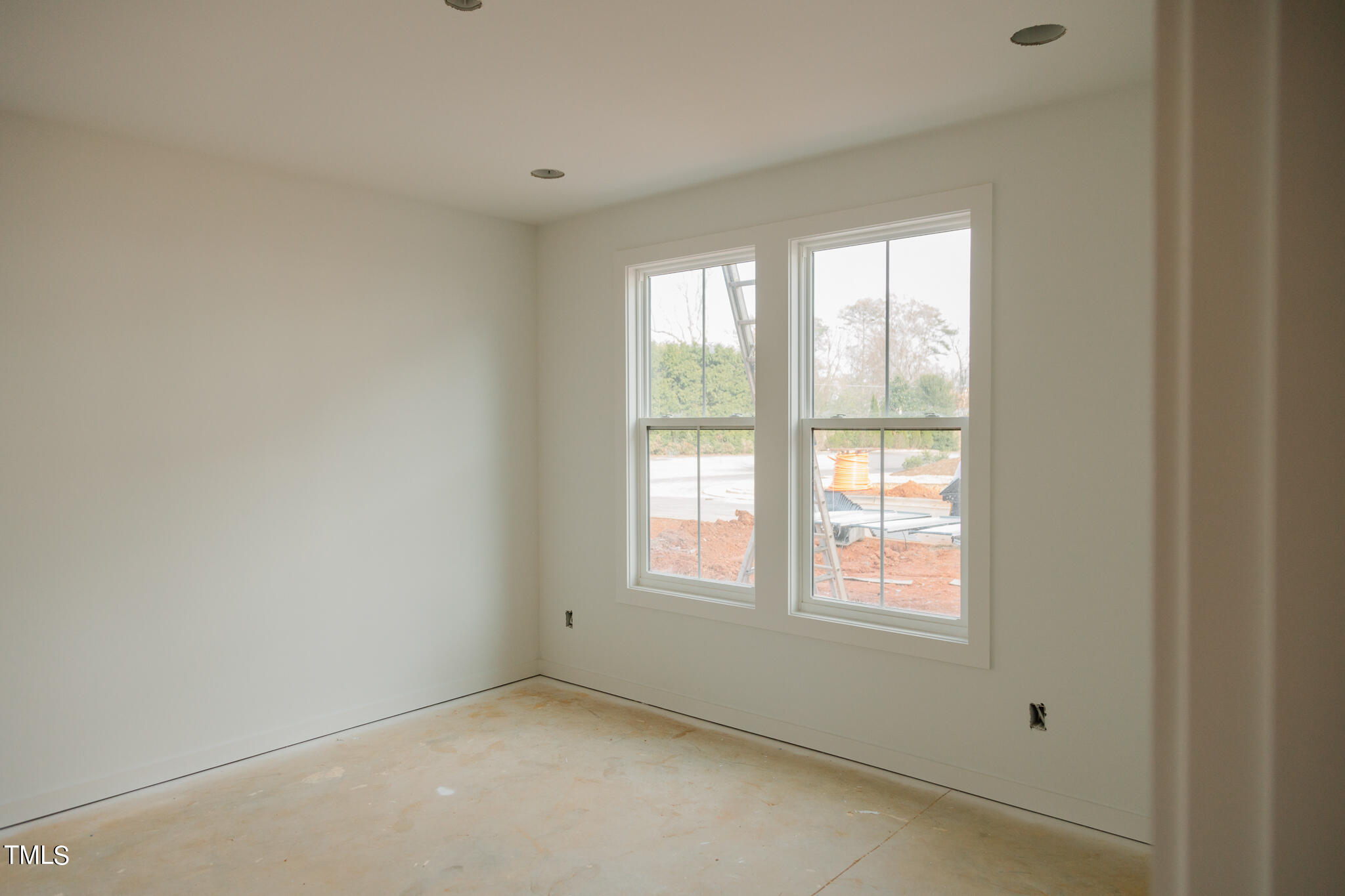 6403 Tanner Oak Lane Raleigh, NC 27613 - Photo 11 of 35 a view of an empty room with a window