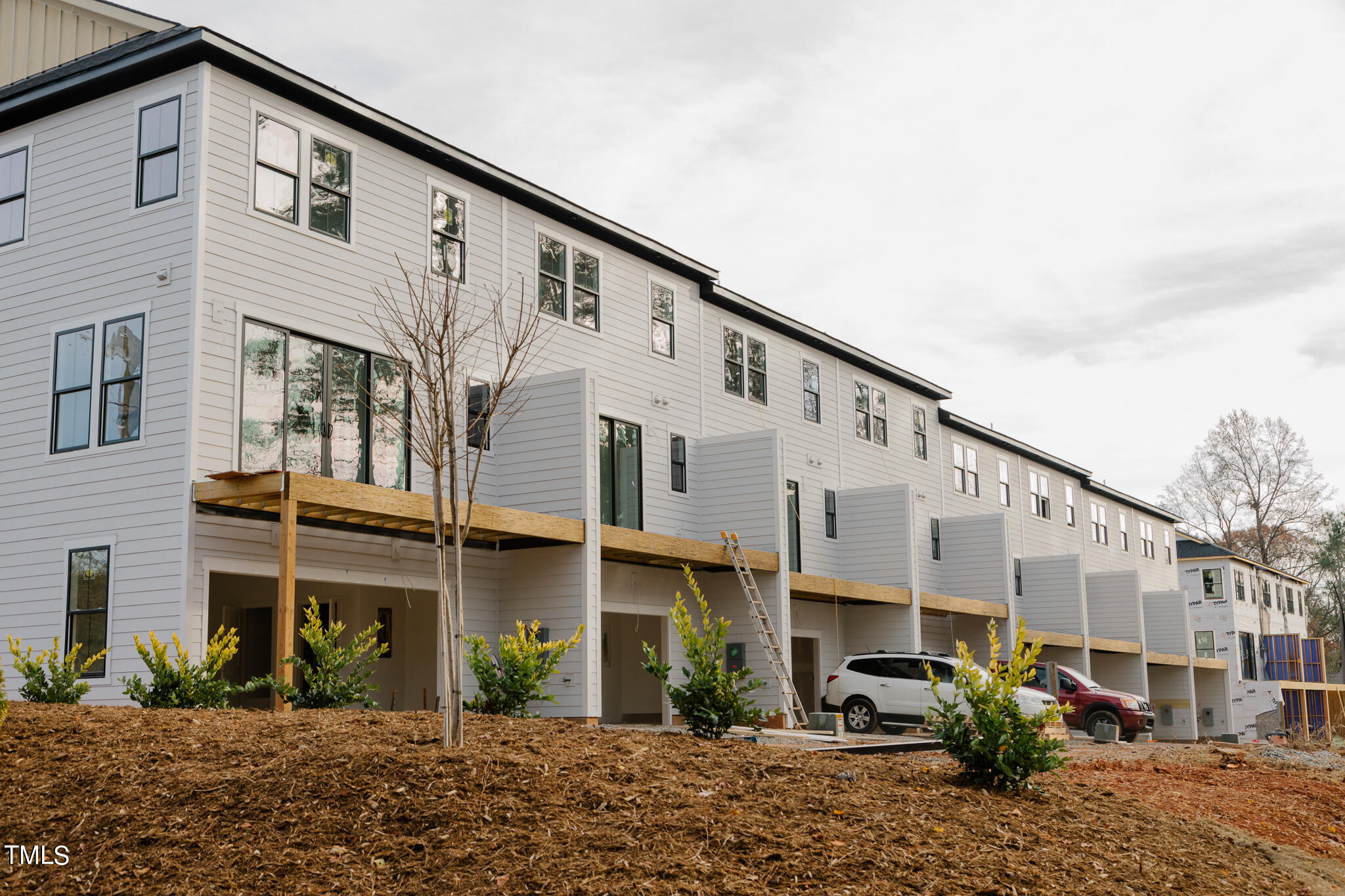 6403 Tanner Oak Lane Raleigh, NC 27613 - Photo 14 of 35 a view of a large white building