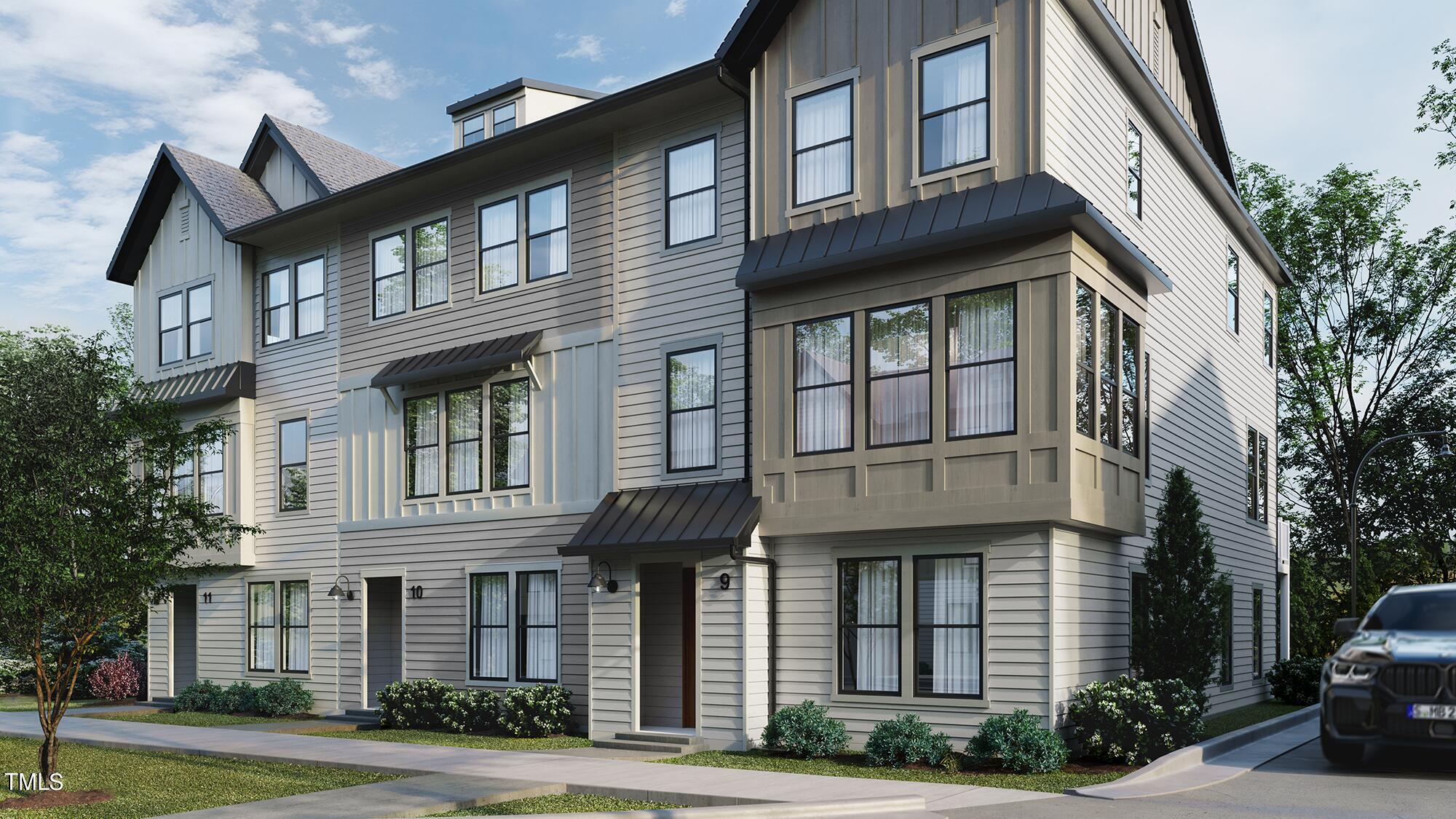 6403 Tanner Oak Lane Raleigh, NC 27613 - Photo 19 of 35 a front view of a residential apartment building with a yard