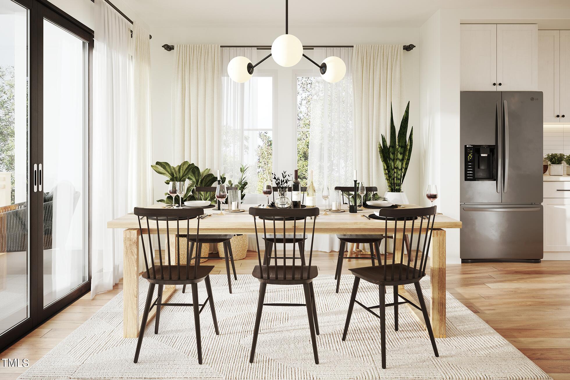 6403 Tanner Oak Lane Raleigh, NC 27613 - Photo 22 of 35 a view of a dining room with furniture window and wooden floor