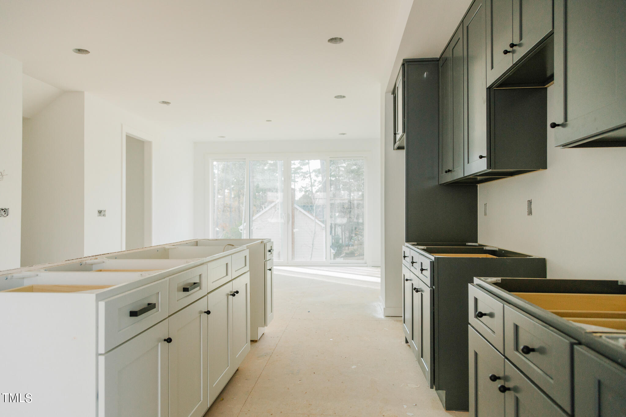 6403 Tanner Oak Lane Raleigh, NC 27613 - Photo 6 of 35 a kitchen with a sink stove and cabinets