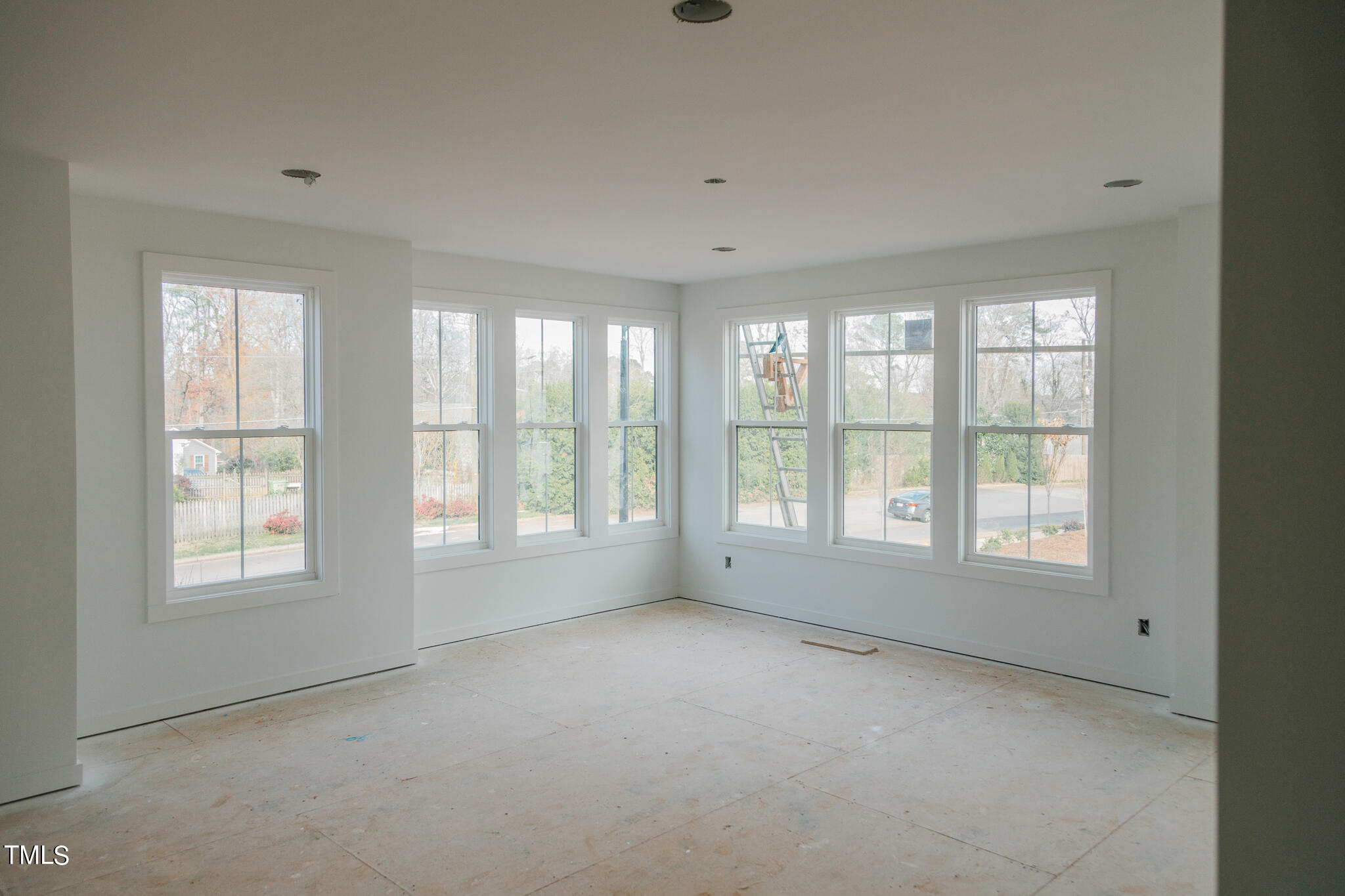 6403 Tanner Oak Lane Raleigh, NC 27613 - Photo 7 of 35 a view of an empty room with a window