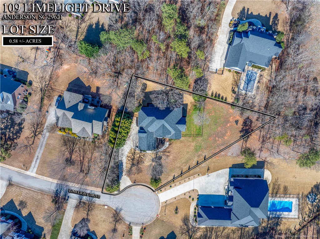 109 Limelight Drive Anderson, SC 29621 - Photo 30 of 34 An aerial view showcases a residential property with surrounding greenery and neighborhood infrastructure.