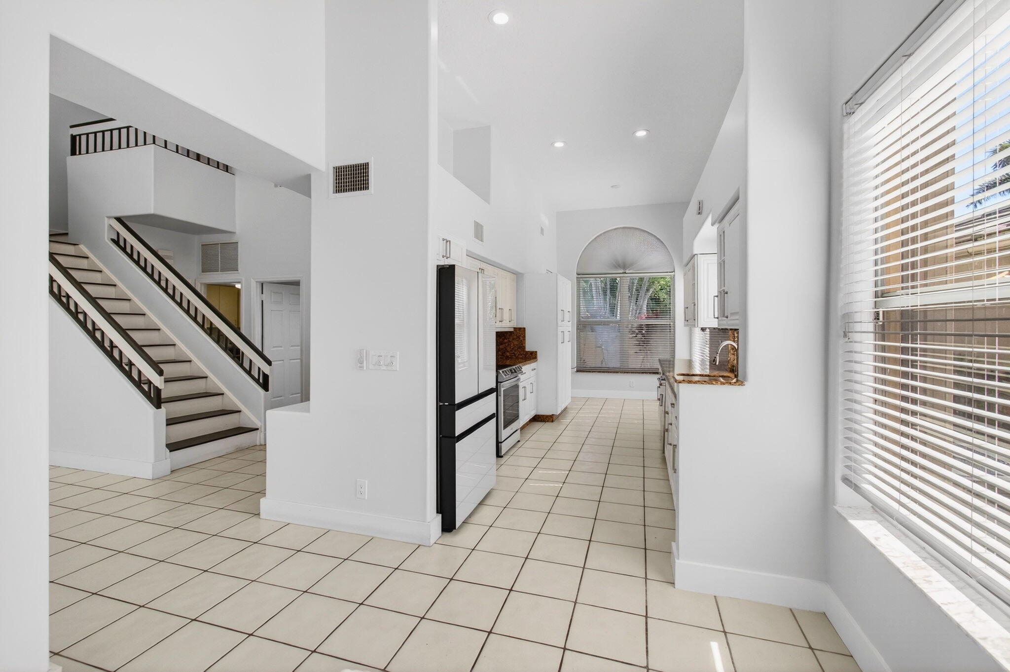 7848 Travelers Tree Drive Boca Raton, FL 33433 - Photo 11 of 60 a view of entryway and hall with wooden floor
