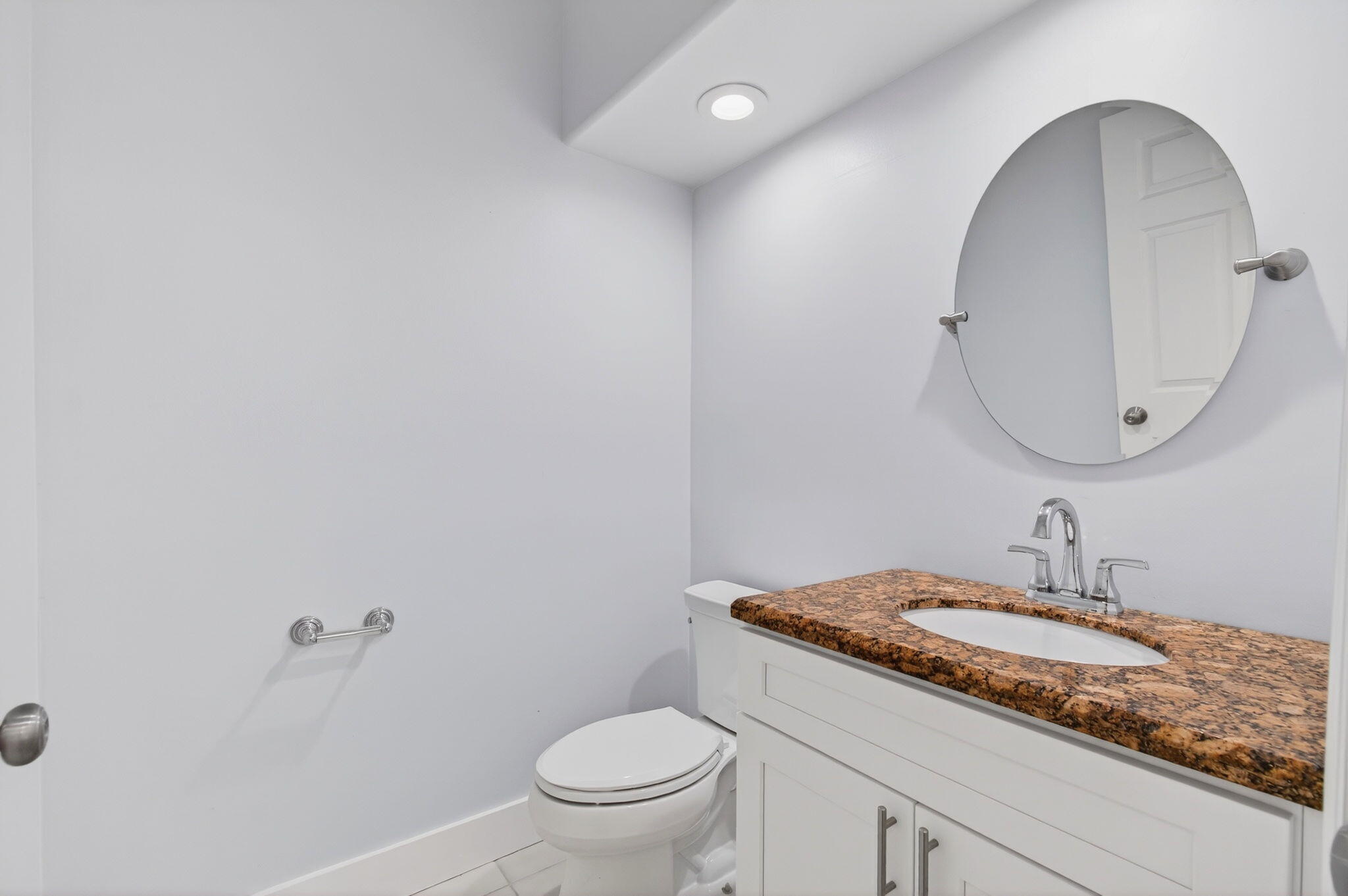 7848 Travelers Tree Drive Boca Raton, FL 33433 - Photo 20 of 60 a bathroom with a granite countertop sink a toilet and a mirror
