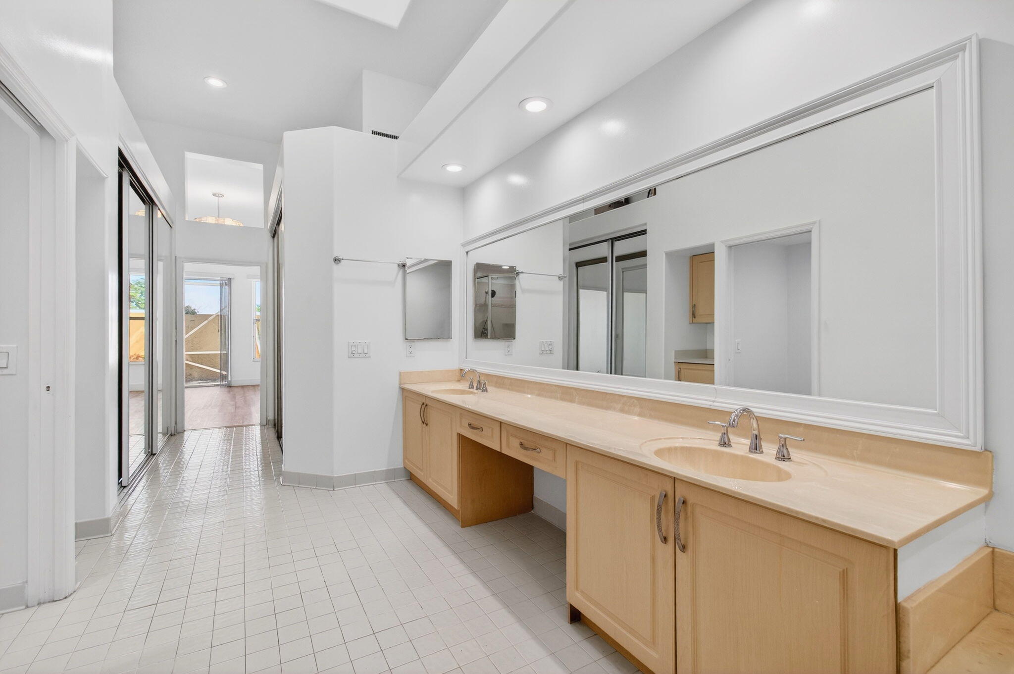 7848 Travelers Tree Drive Boca Raton, FL 33433 - Photo 28 of 60 a spacious bathroom with a double vanity sink mirror and double