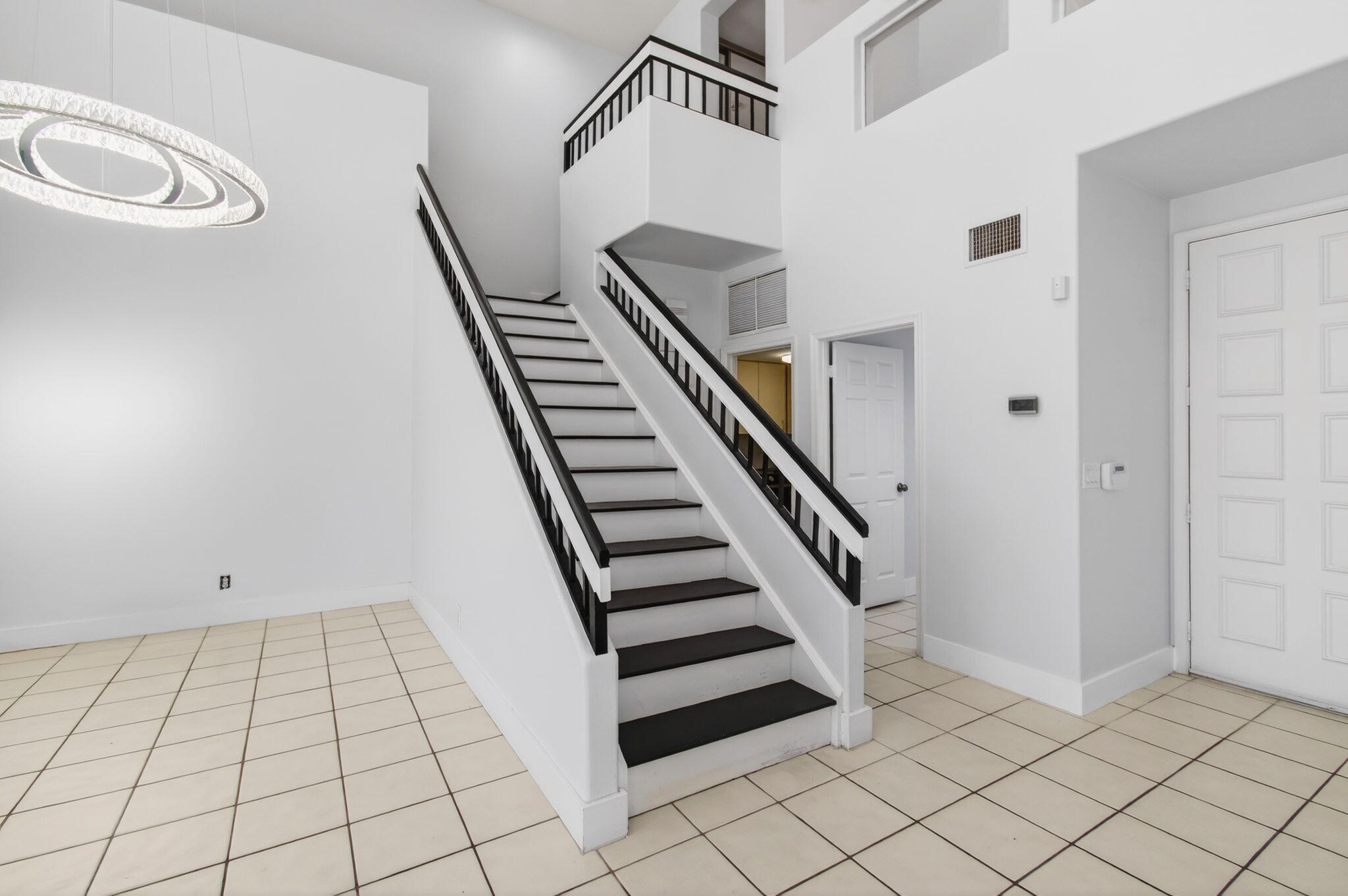 7848 Travelers Tree Drive Boca Raton, FL 33433 - Photo 31 of 60 a view of an entryway with staircase