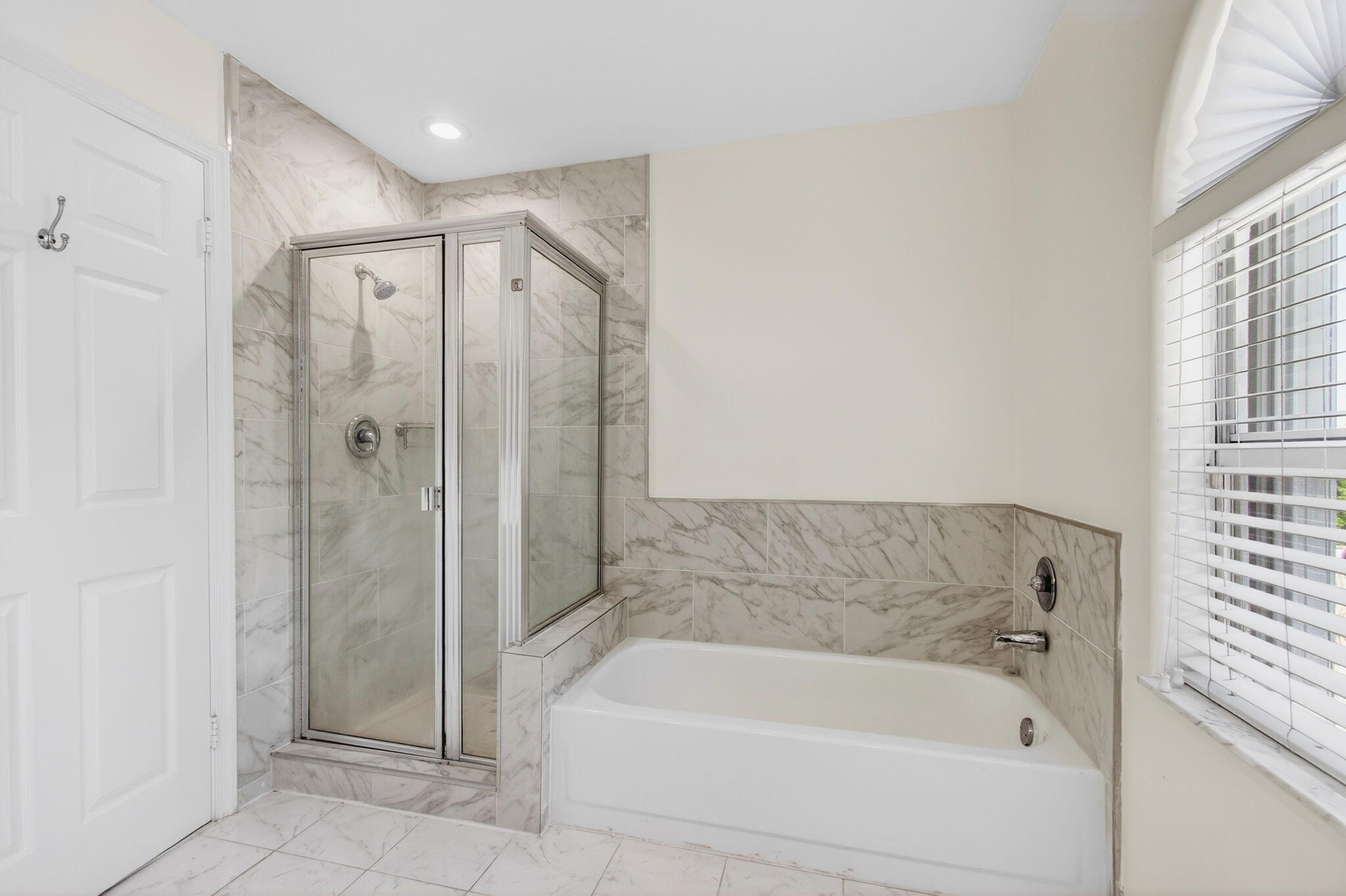 7848 Travelers Tree Drive Boca Raton, FL 33433 - Photo 38 of 60 a bathroom with a bathtub and a shower