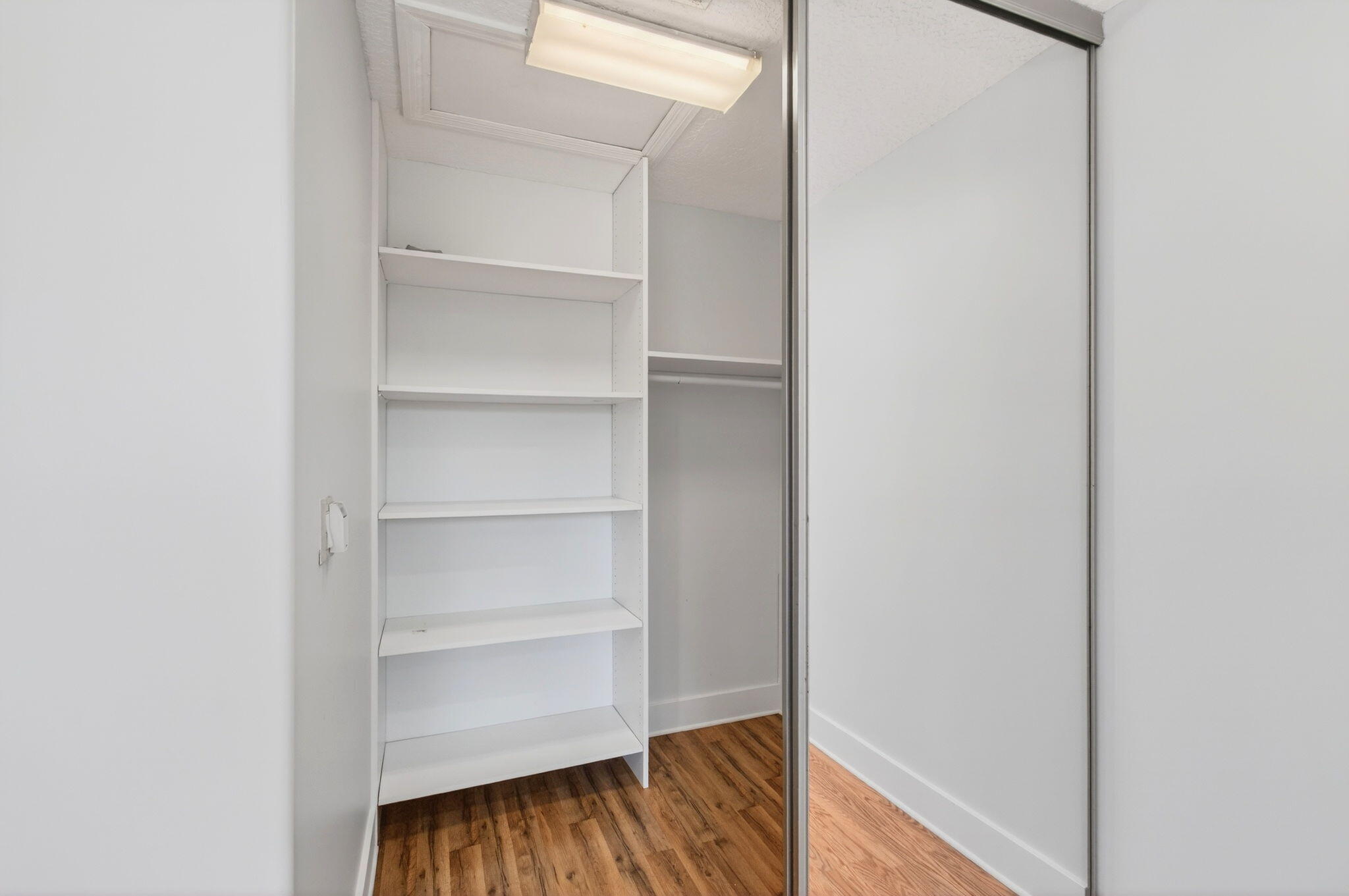 7848 Travelers Tree Drive Boca Raton, FL 33433 - Photo 42 of 60 a view of walk in closet with empty racks