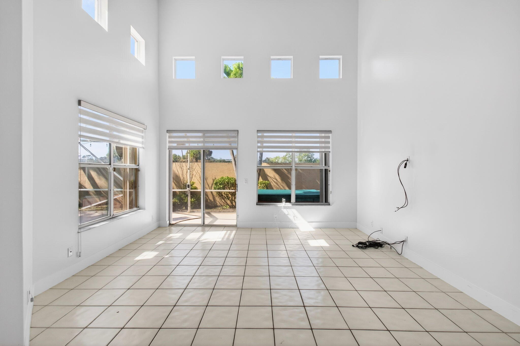 7848 Travelers Tree Drive Boca Raton, FL 33433 - Photo 6 of 60 a view of an empty room and window