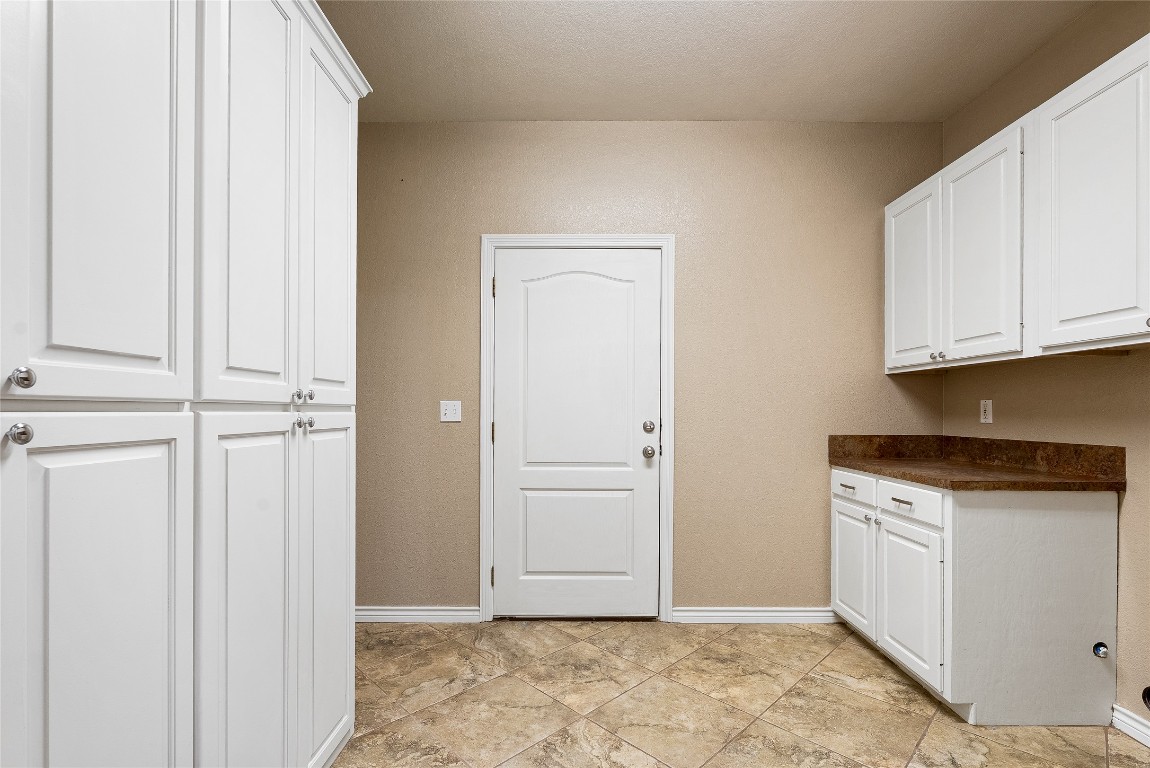 230 Cedar Hills Drive Elgin, TX 78621 - Photo 20 of 40 a view of cabinets with wooden floor