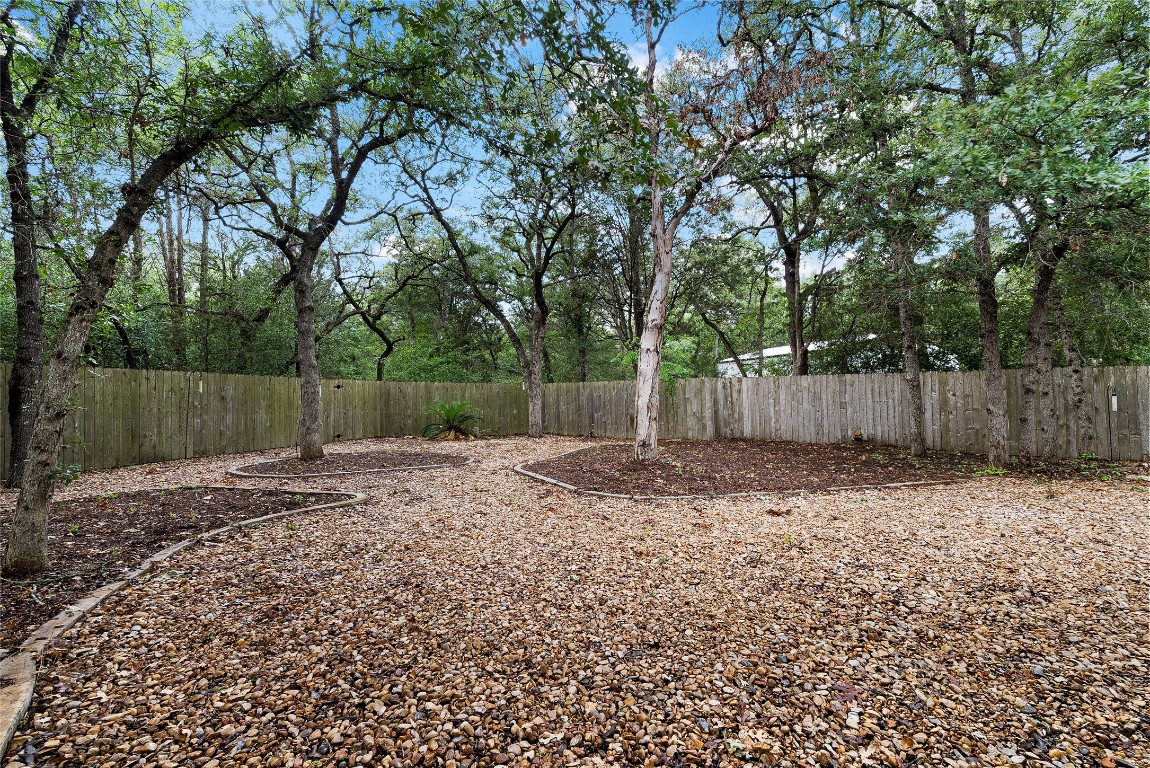 230 Cedar Hills Drive Elgin, TX 78621 - Photo 23 of 40 a backyard of a house with lots of green space