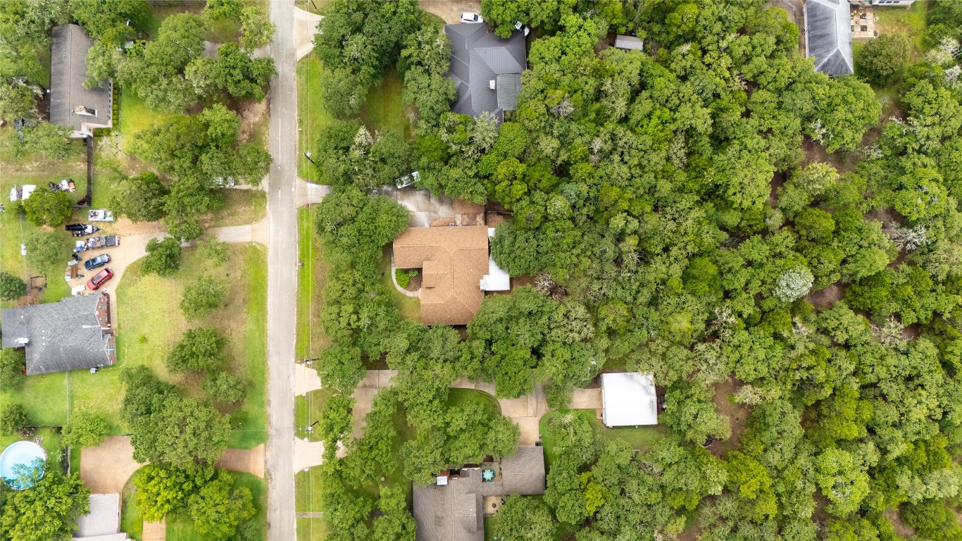 230 Cedar Hills Drive Elgin, TX 78621 - Photo 33 of 40 an aerial view of a house with swimming pool and garden