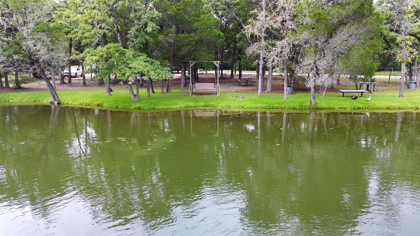 230 Cedar Hills Drive Elgin, TX 78621 - Photo 36 of 40 a garden view with a lake view