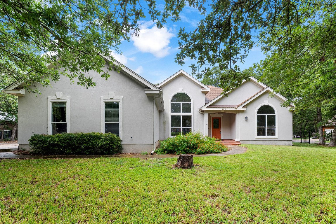 230 Cedar Hills Drive Elgin, TX 78621 - Photo 40 of 40 a front view of a house with a garden