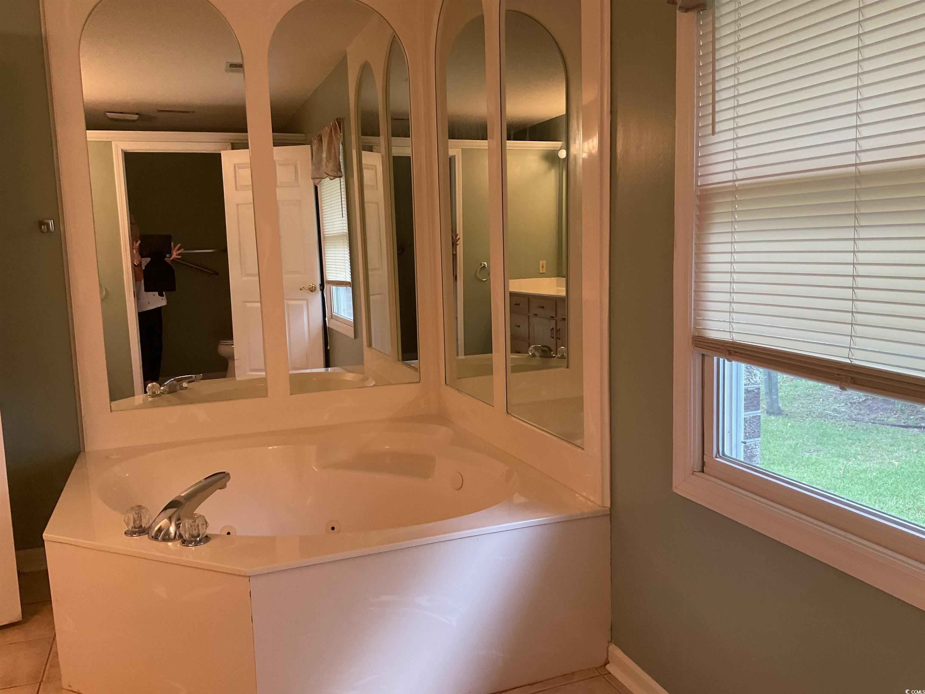 617 Waccamaw River Road Myrtle Beach, SC 29588 - Photo 13 of 17 Full bath featuring a whirlpool tub and tile patte
