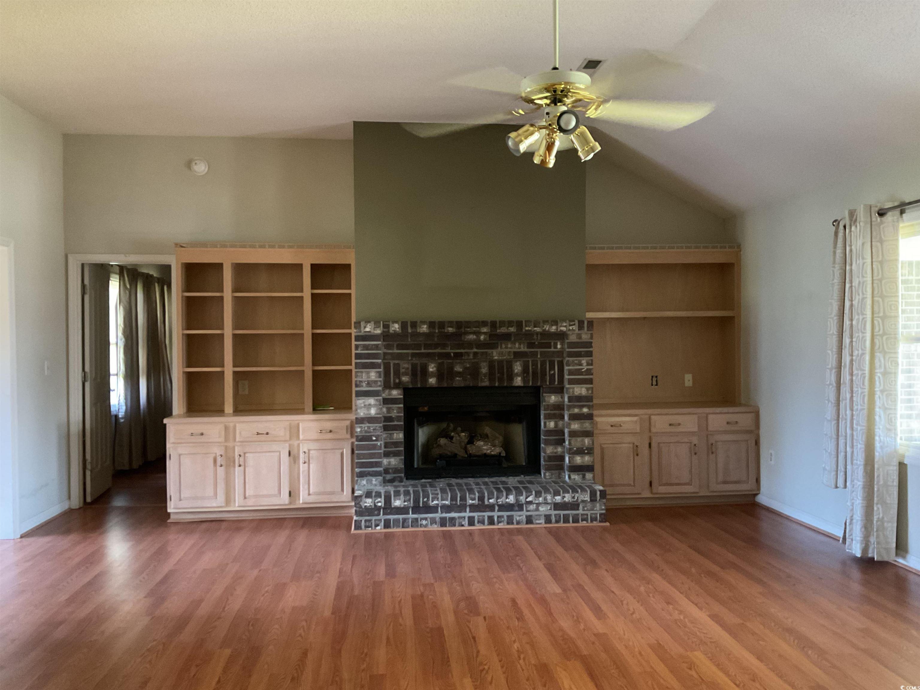 617 Waccamaw River Road Myrtle Beach, SC 29588 - Photo 2 of 17 Unfurnished living room with wood finished floors,