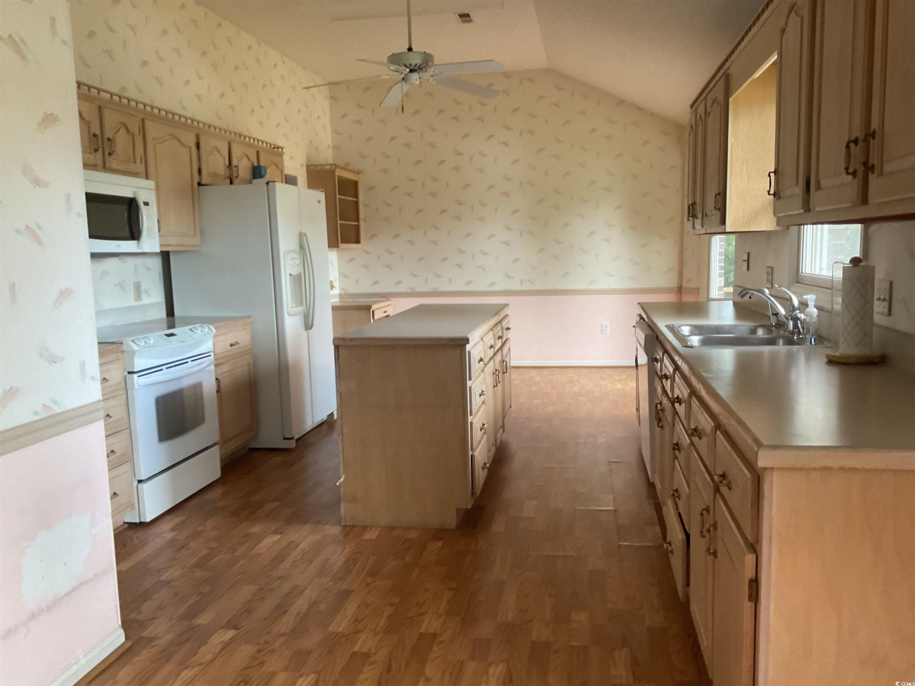 617 Waccamaw River Road Myrtle Beach, SC 29588 - Photo 5 of 17 Kitchen featuring wallpapered walls, a wainscoted