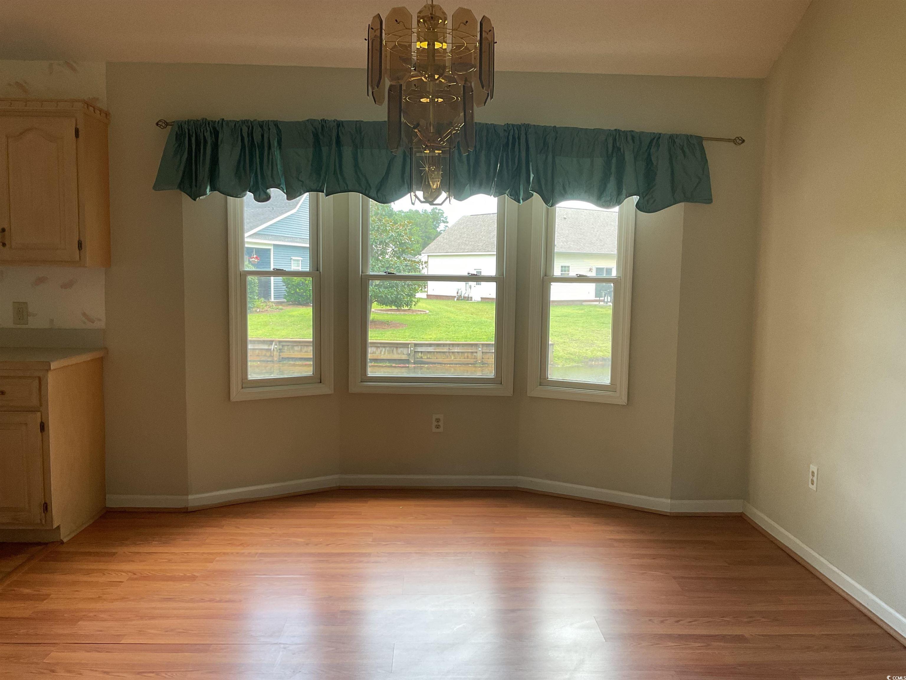 617 Waccamaw River Road Myrtle Beach, SC 29588 - Photo 8 of 17 Unfurnished dining area featuring a chandelier and