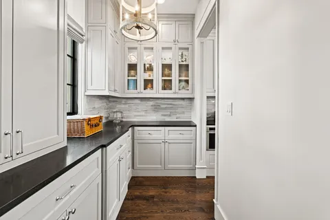 a kitchen with stainless steel appliances granite countertop a stove and cabinets