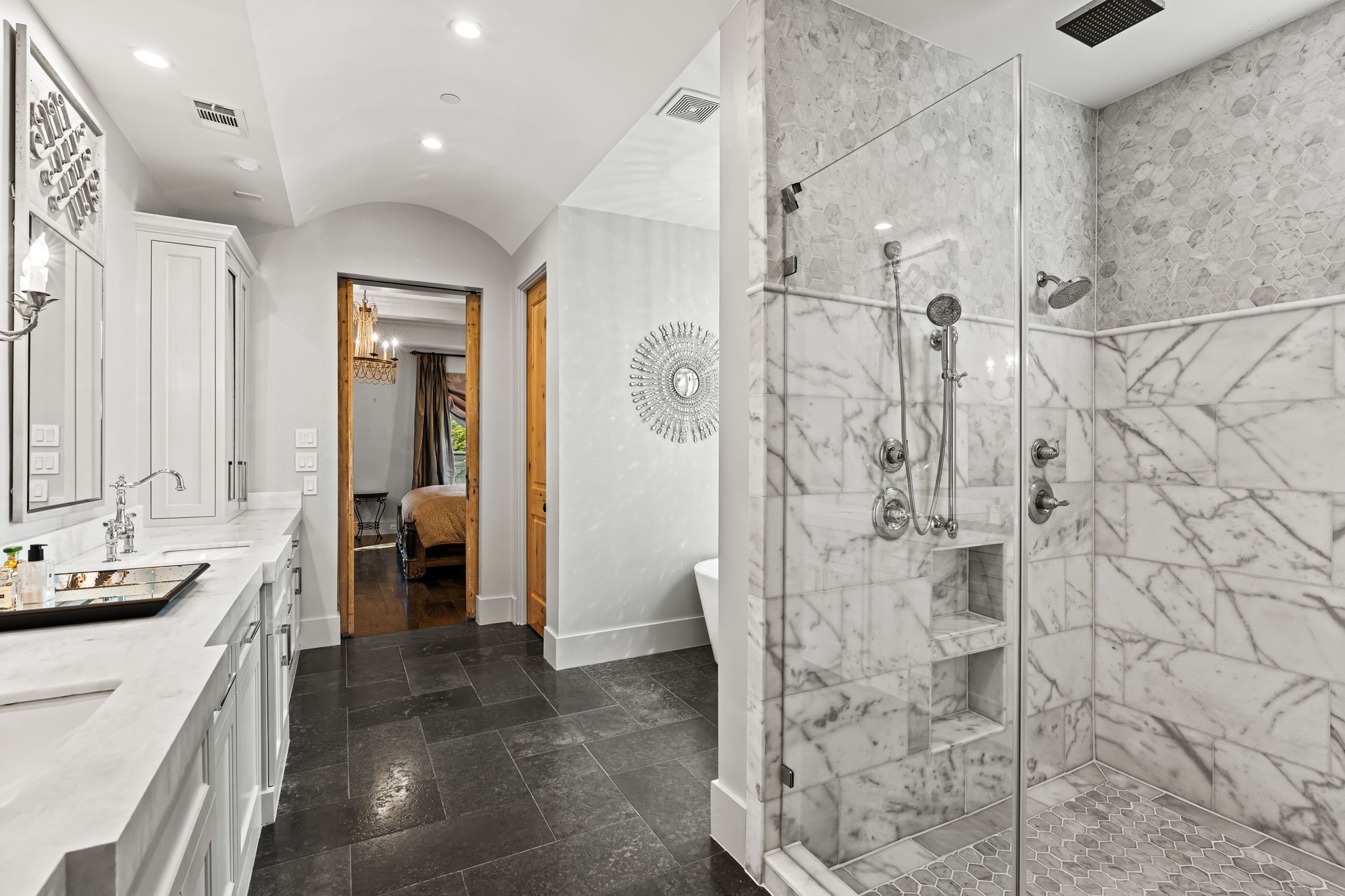 8307 Maple Court Bellaire, TX 77401 - Photo 20 of 30 a bathroom with a shower and a sink