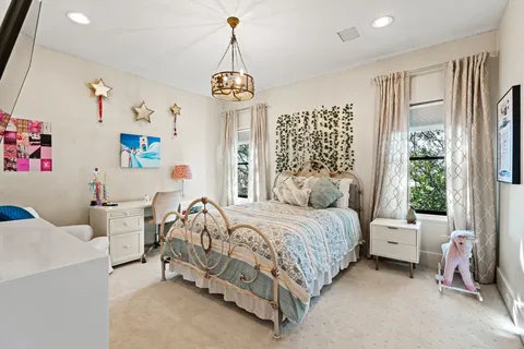 a bedroom with a bed and a table in it