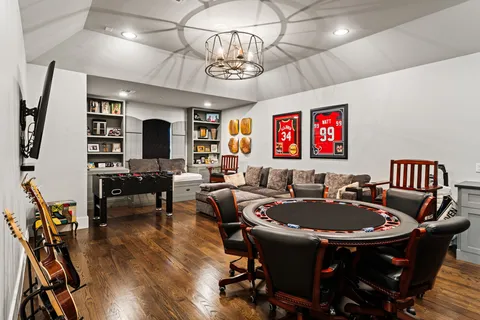 a view of a dining room with furniture wooden floor and chandelier