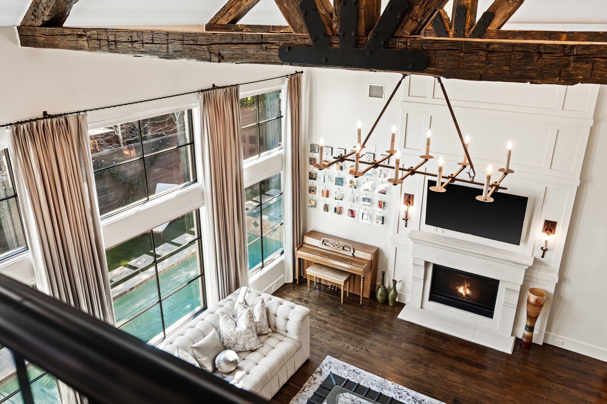 8307 Maple Court Bellaire, TX 77401 - Photo 27 of 30 a living room with a fireplace furniture and a floor to ceiling window