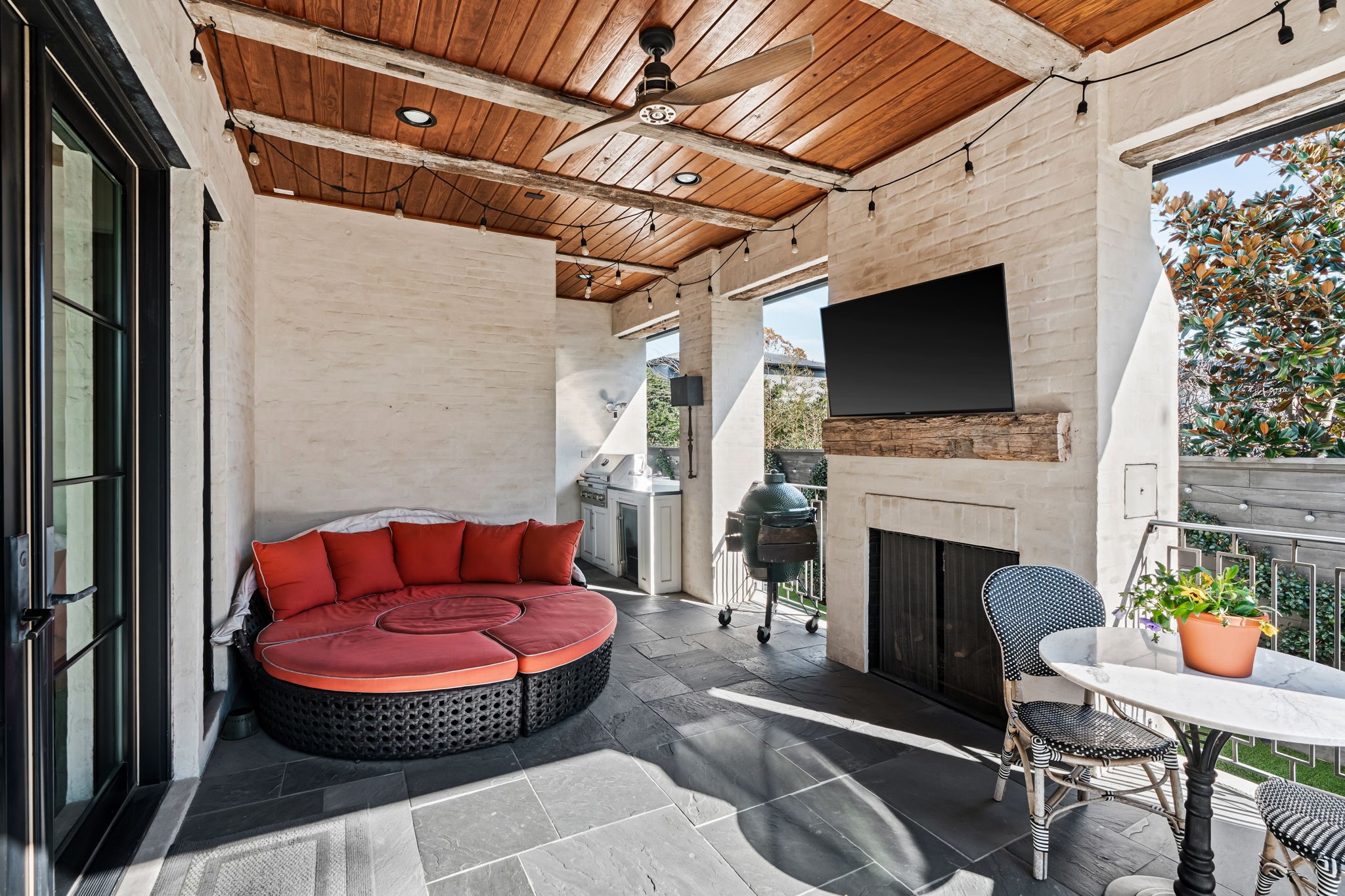 8307 Maple Court Bellaire, TX 77401 - Photo 28 of 30 a outdoor living space with furniture and a fireplace