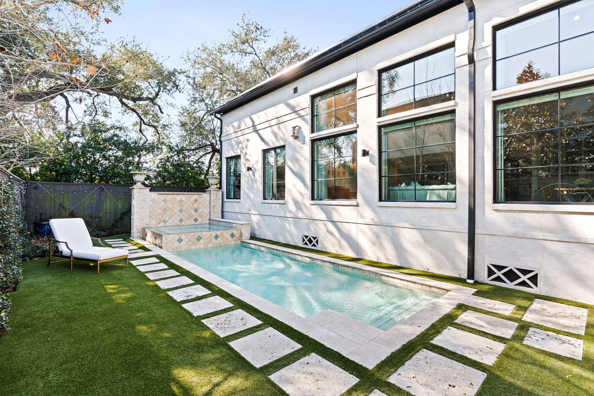 8307 Maple Court Bellaire, TX 77401 - Photo 29 of 30 a view of a house with pool and sitting area