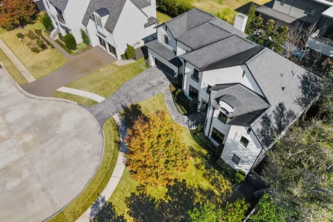 an aerial view of a house with a swimming pool