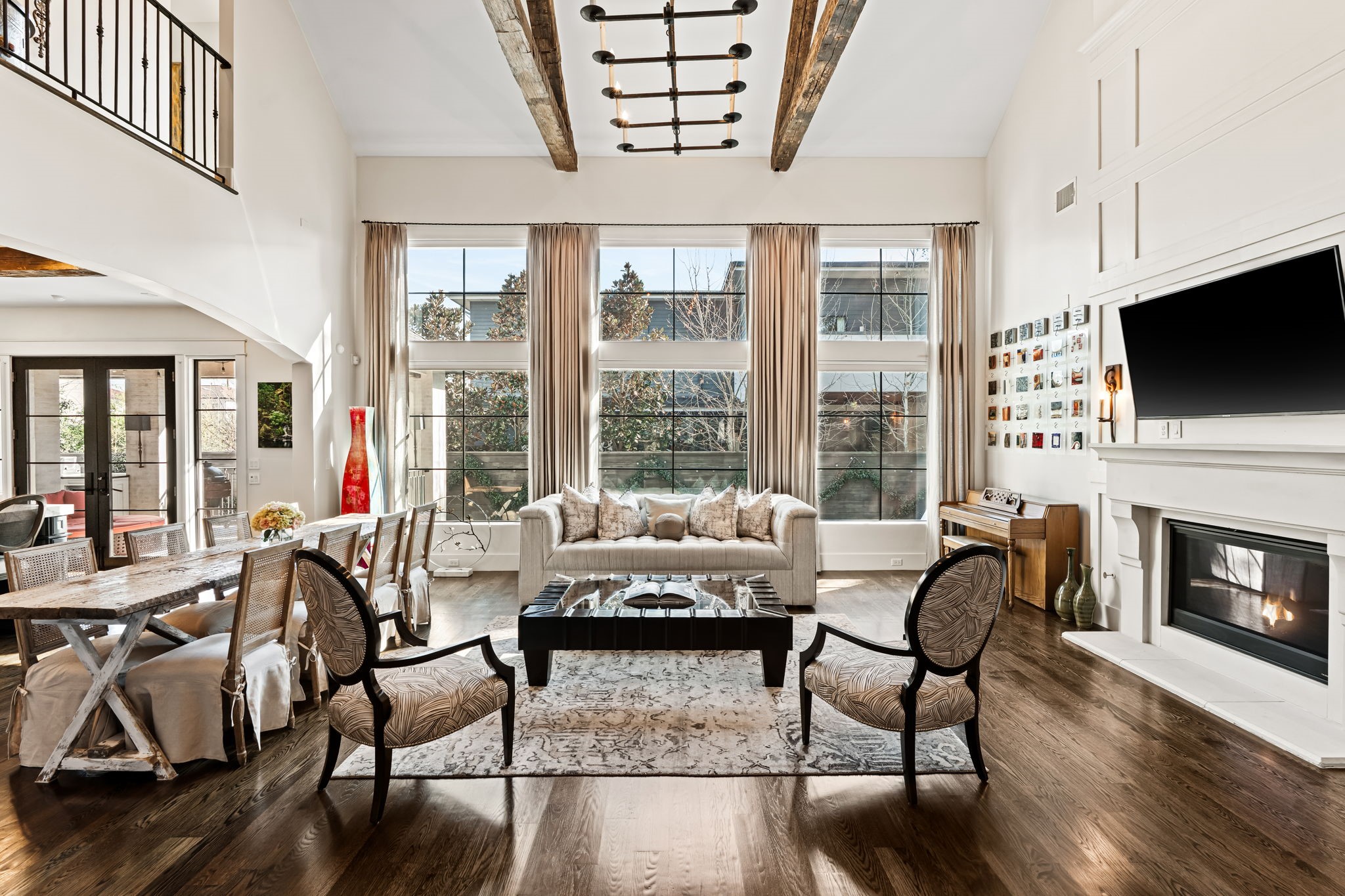 8307 Maple Court Bellaire, TX 77401 - Photo 6 of 30 a living room with furniture a fireplace and a flat screen tv