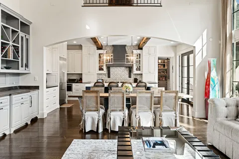 a view of living room filled with furniture and floor to ceiling window