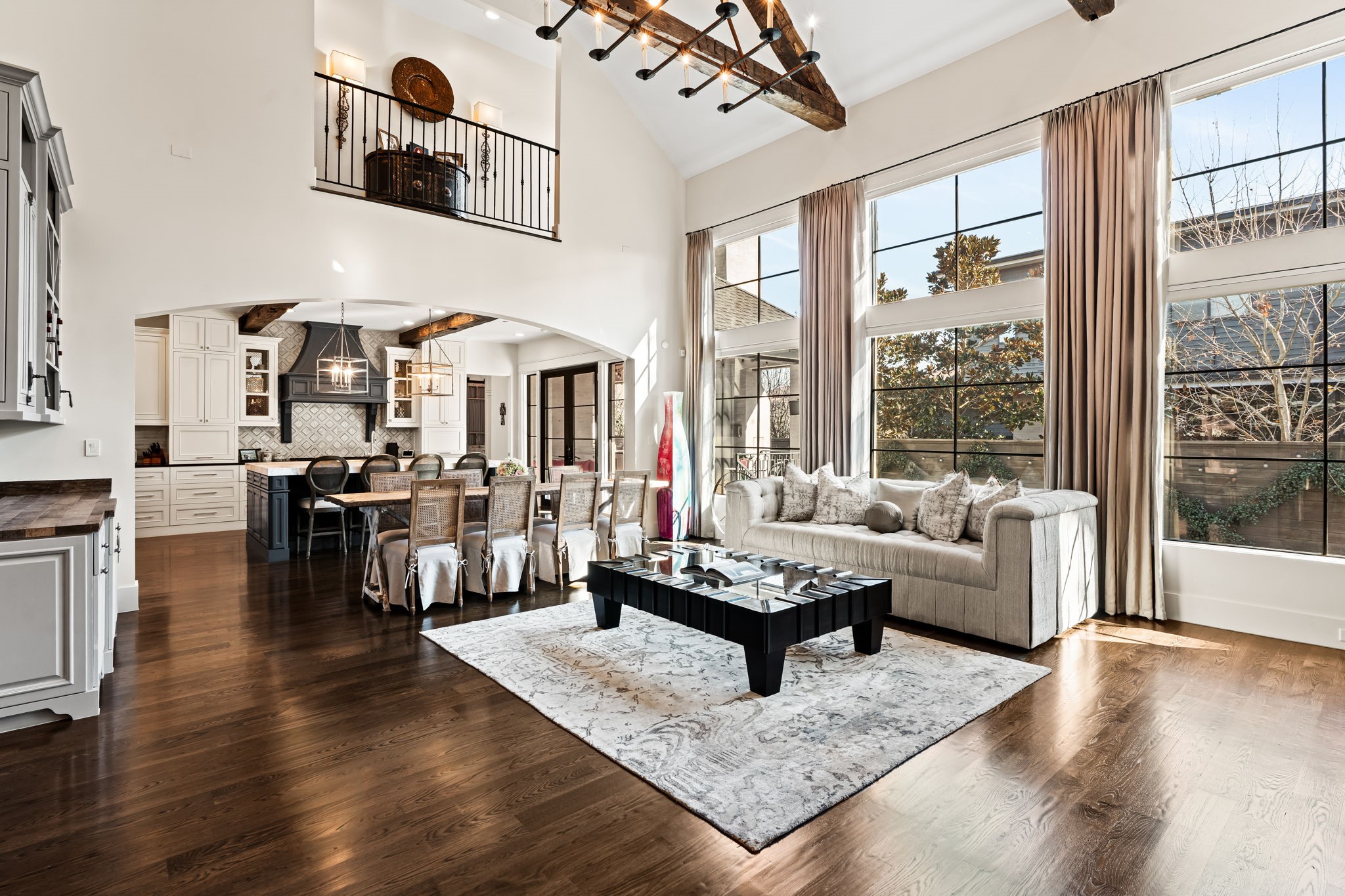 8307 Maple Court Bellaire, TX 77401 - Photo 8 of 30 a living room with furniture and floor to ceiling windows