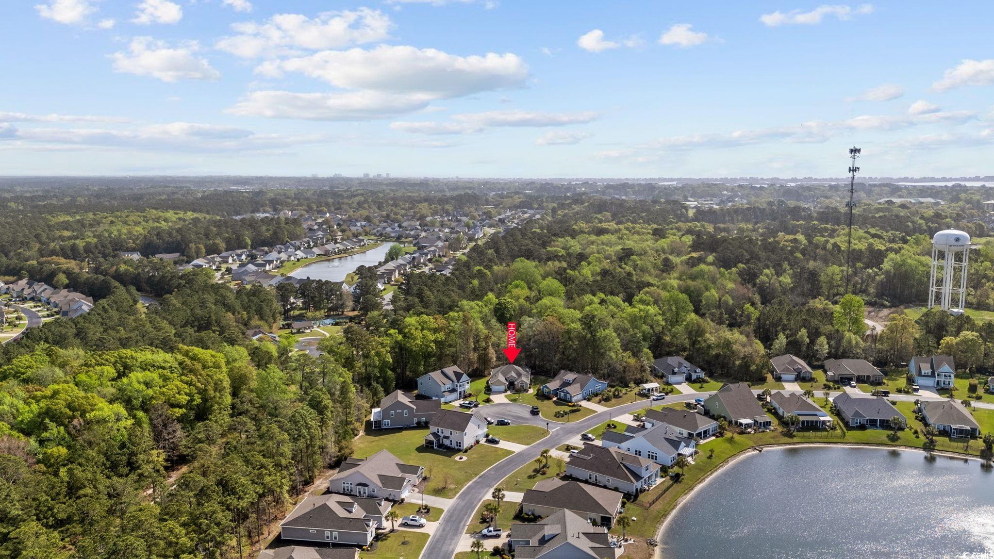 22 Salvia Court Murrells Inlet, SC 29576 - Photo 68 of 69 Aerial overview of property's location featuring a large body of water and nearby suburban area