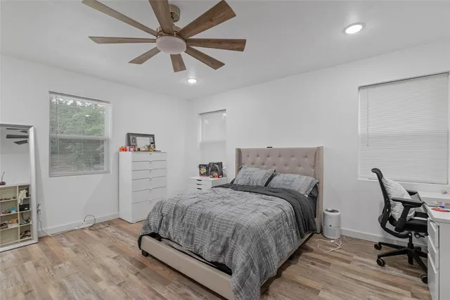 a bedroom with a bed and a table in it