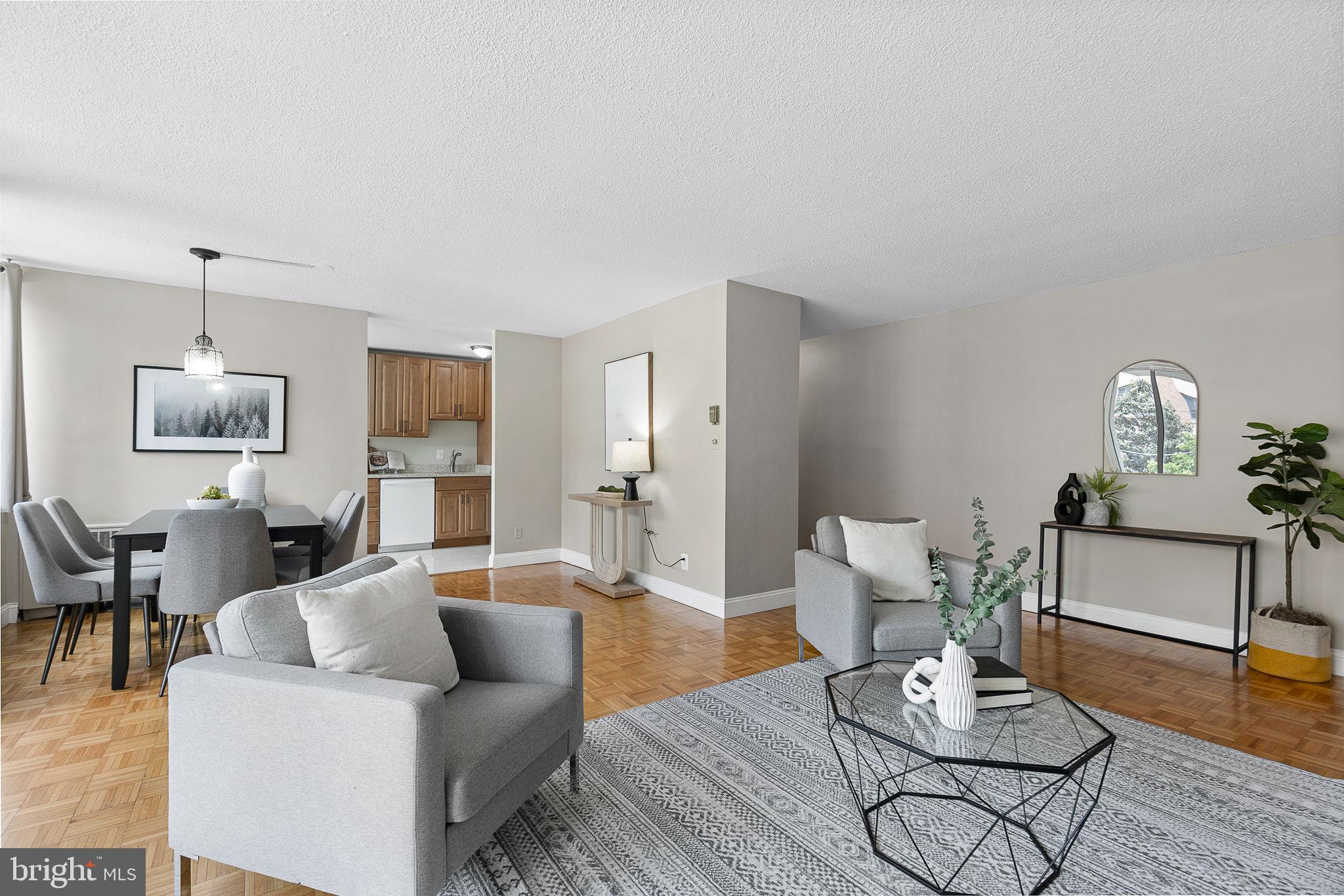 1301 South Arlington Ridge Road, Unit 208 Arlington, VA 22202 - Photo 11 of 23 a living room with furniture and wooden floor