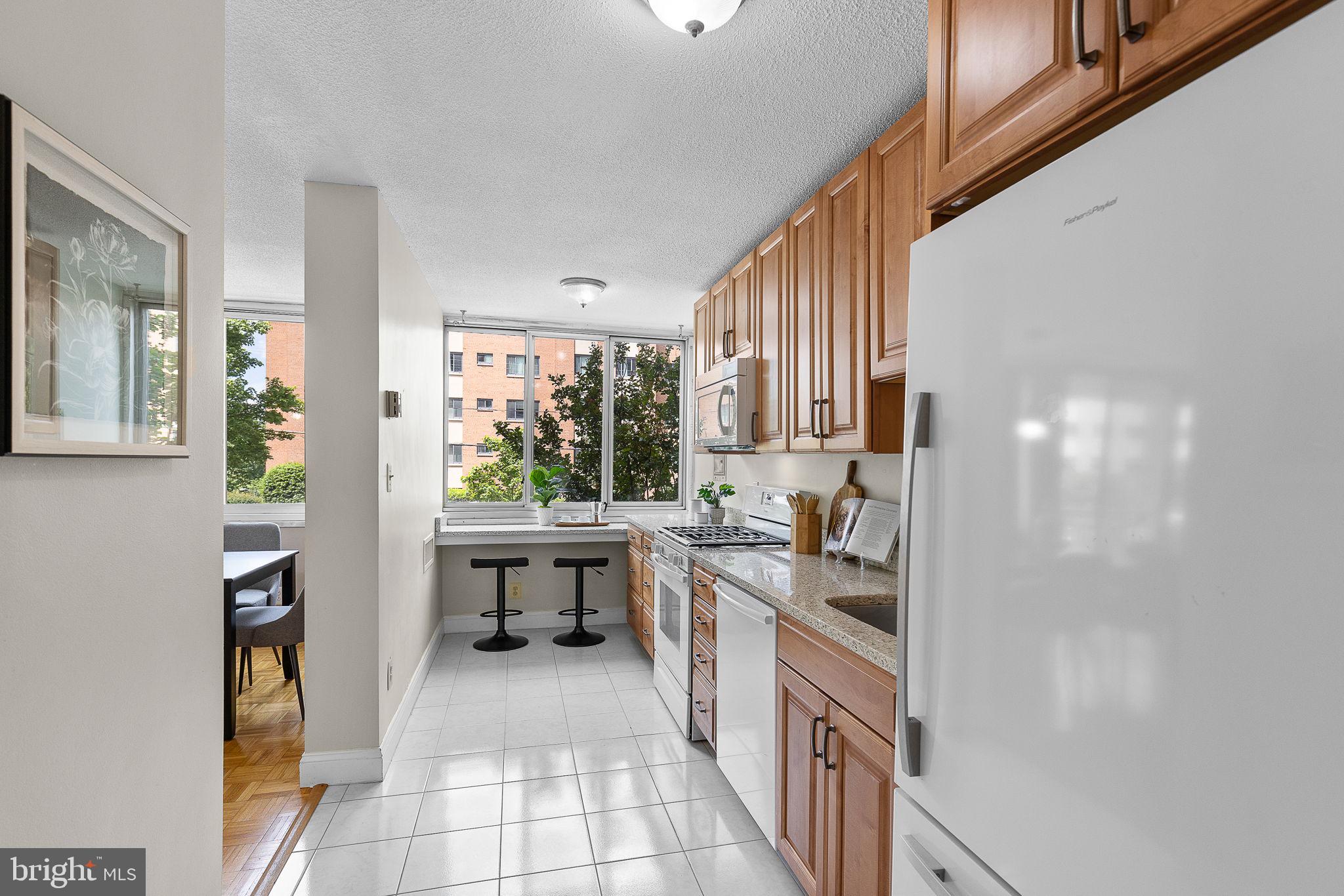 1301 South Arlington Ridge Road, Unit 208 Arlington, VA 22202 - Photo 15 of 23 a kitchen with a sink and cabinets